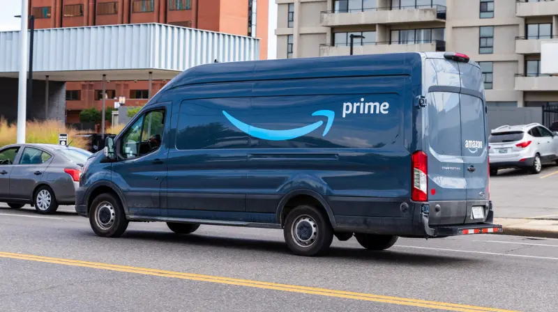 Amazon delivery van with the Amazon Prime logo